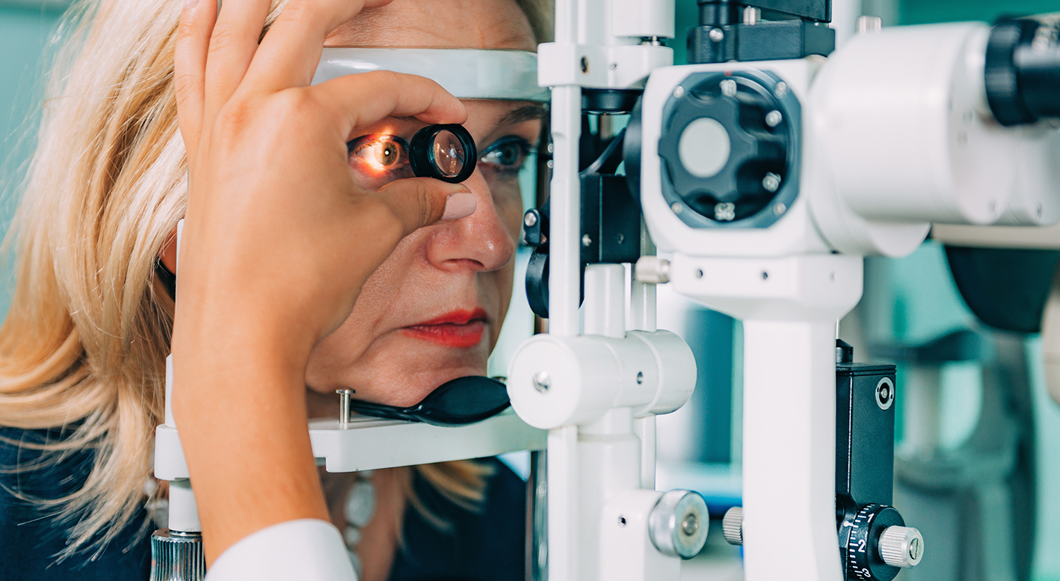 Eye-Docter-Hero A patient undergoing a comprehensive eye examination with a slit lamp microscope.